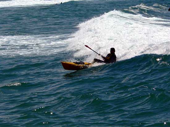 Kayak Fisherman Surfing