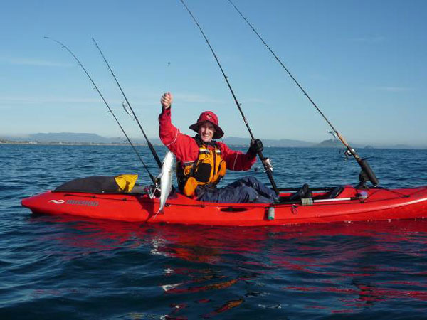 Kayak Fisherman landing fish