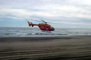 Helecopter rescues four wheel drive vans passengers