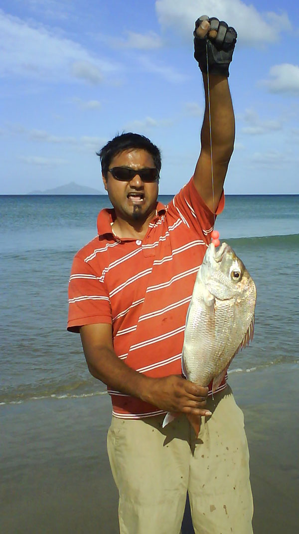 Catching snapper at Uretiti Beach